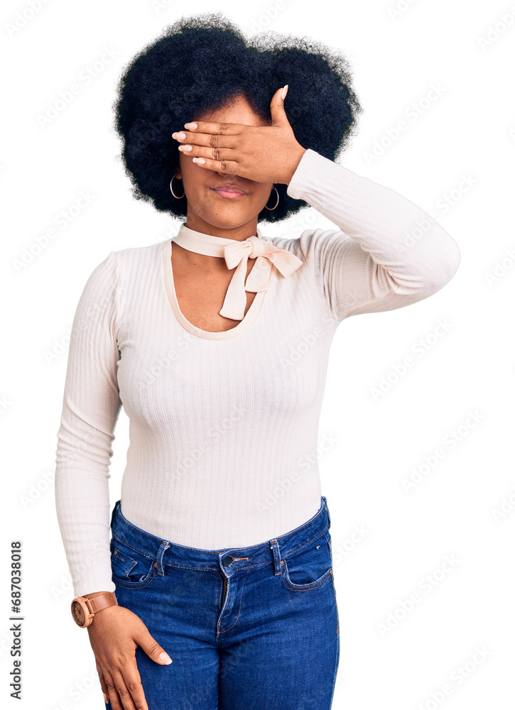 Poster Young african american girl wearing casual clothes and glasses covering eyes with hand, looking serious and sad. sightless, hiding and rejection concept