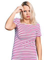 Young caucasian woman wearing casual clothes worried and stressed about a problem with hand on forehead, nervous and anxious for crisis