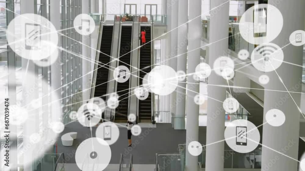 Aufkleber animation of connected icons over aerial view of diverse people using escalators of building