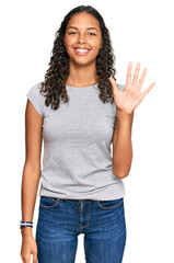 Young african american girl wearing casual clothes showing and pointing up with fingers number five...