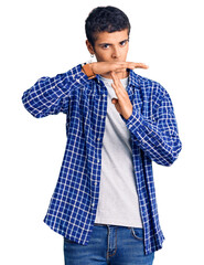 Young african amercian man wearing casual clothes doing time out gesture with hands, frustrated and...