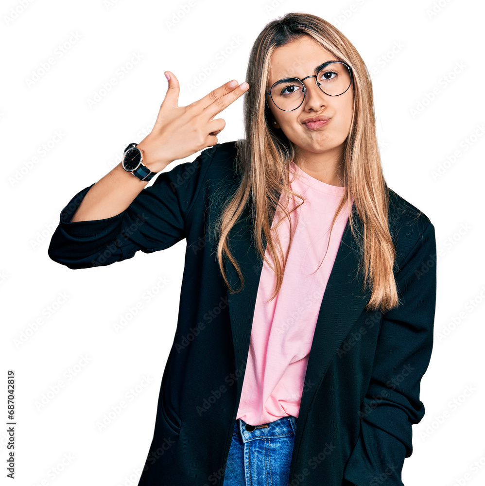 Poster hispanic young woman wearing business jacket and glasses shooting and killing oneself pointing hand 