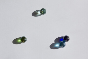 Clear glass bead reflect light on the white background.