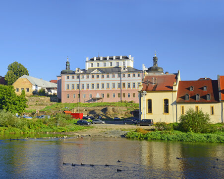 The Sazava River and the town of Kacov with a brewery and a baroque castle on the river bank. Bohemia, Czech Republic