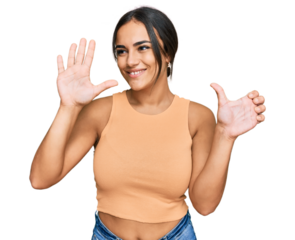 Young brunette woman wearing casual clothes showing and pointing up with fingers number six while smiling confident and happy.