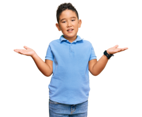 Little boy hispanic kid wearing casual clothes smiling cheerful offering hands giving assistance and acceptance.