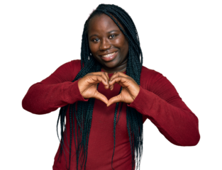 Young black woman with braids wearing casual clothes smiling in love showing heart symbol and shape with hands. romantic concept.