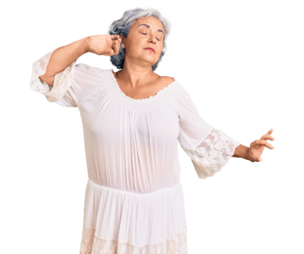 Senior woman with gray hair wearing bohemian style stretching back, tired and relaxed, sleepy and yawning for early morning - Powered by Adobe