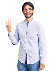 Handsome hispanic man wearing business shirt and glasses showing and pointing up with fingers number three while smiling confident and happy.