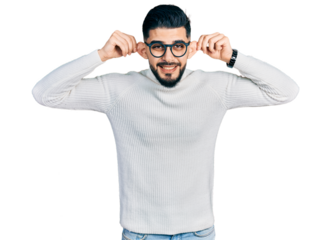 Young arab man with beard wearing elegant turtleneck sweater and glasses smiling pulling ears with fingers, funny gesture. audition problem