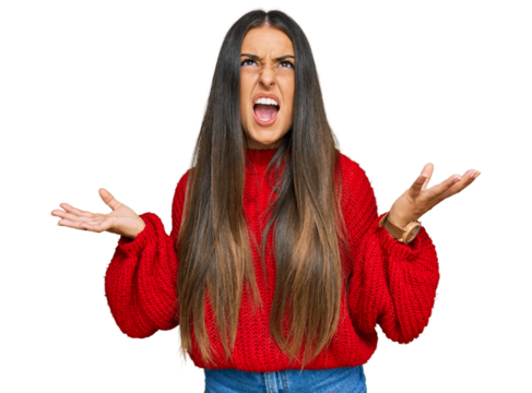 Beautiful hispanic woman wearing casual clothes crazy and mad shouting and yelling with aggressive expression and arms raised. frustration concept.