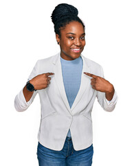 Young african american woman wearing business clothes looking confident with smile on face,...
