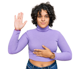 Young hispanic woman with curly hair wearing casual clothes swearing with hand on chest and open palm, making a loyalty promise oath