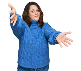 Young plus size woman wearing casual clothes looking at the camera smiling with open arms for hug. cheerful expression embracing happiness.