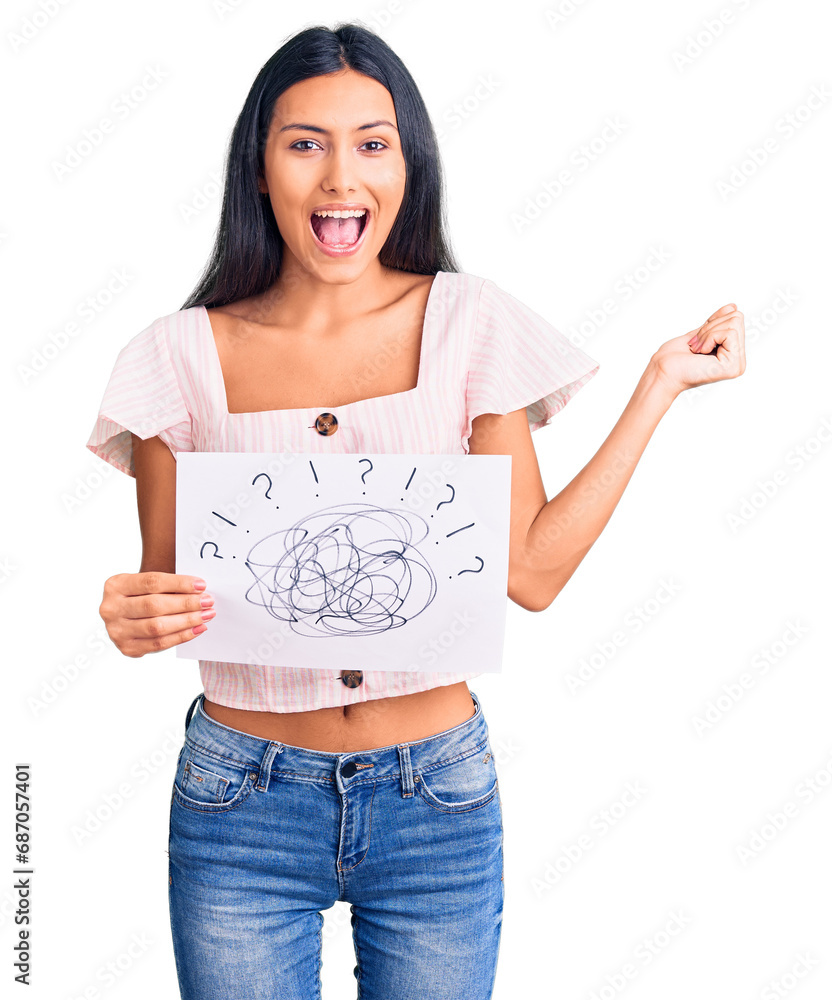 Canvas Prints Young beautiful latin girl holding scribble draw screaming proud, celebrating victory and success very excited with raised arms