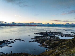 aerial view over port of moskenes and Sørvågen village , lofoten, norway during sunrise