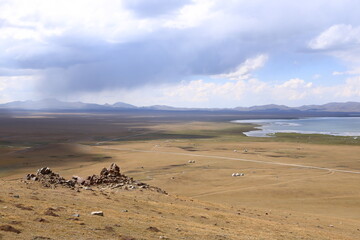 View over Song kol lake, steppe and surrounding mountains, Kyrgyzstan