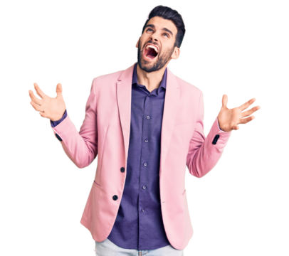 Young handsome man with beard wearing elegant jacket crazy and mad shouting and yelling with aggressive expression and arms raised. frustration concept. - Powered by Adobe