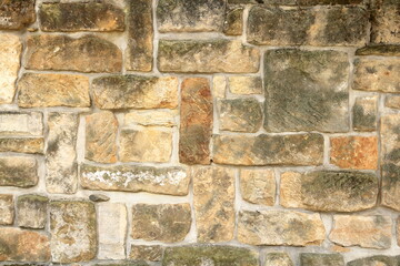 yellow sandstone brick wall