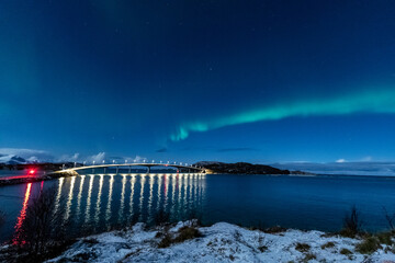 northern light over bridge and Sommarøy insland during winter night