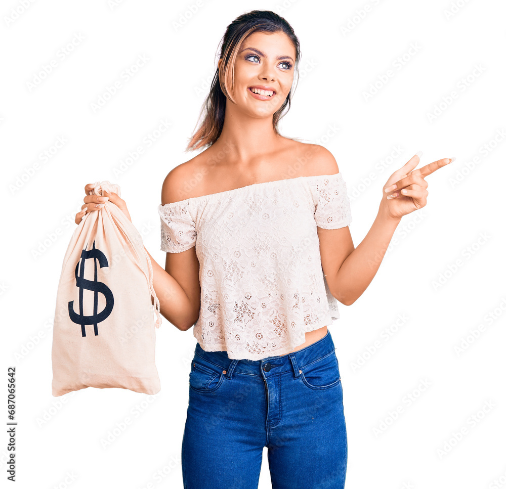 Poster young beautiful woman holding money bag with dollar symbol smiling happy pointing with hand and fing