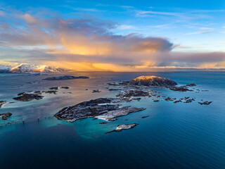 aerial view over Hillesøya and Sommarøy Islands with Storm Clouds during sunrise