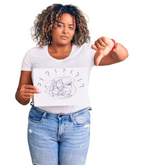 Young african american plus size woman holding scribble draw with angry face, negative sign showing...
