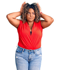 Young african american plus size woman wearing casual style with sleeveless shirt doing bunny ears gesture with hands palms looking cynical and skeptical. easter rabbit concept.