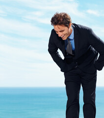 Business man laughing at ocean holiday, vacation and summer travel on sky mockup space. Funny professional lawyer in suit at sea, happy and excited by water at beach outdoor for freedom in Cancun