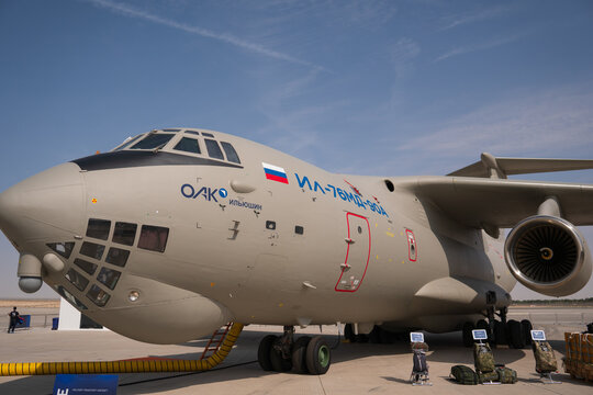 Dubai, United Arab Emirates -November 15th 2023: Russian military transport plane, Ilyushine Il-76MD-90A, on display at the Dubai Airshow, with military equipment on the ground. blue sky