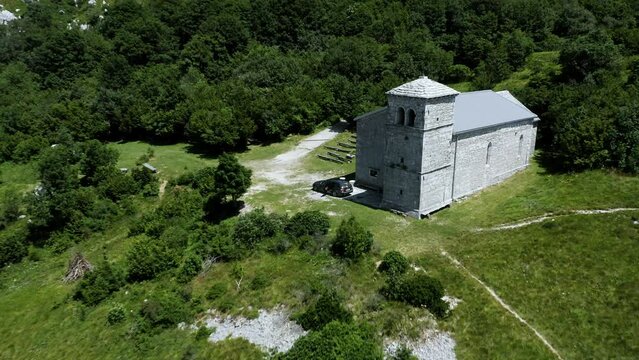 Flying Towards Church of St. Jerome Located On Top Of The Nanos Hill, Plateau, Surrounded With Beautiful Green Scenery, Trees, Bushes, Rocks, Stones, Hiking Trail Leading Towards Church.