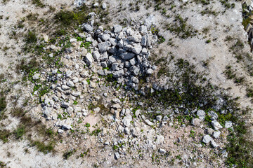 Top view of scattered limestone blocks at a stone quarry