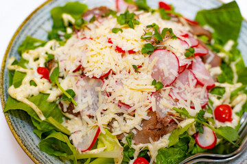 Delicious Vegetarian Plate with Fresh Produce and Kitchen Utensils. Fresh and nutritious vegetarian meal, prepared in a modern kitchen.