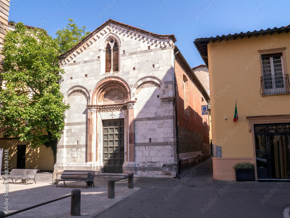 Wall mural the small church of santa giulia with its characteristic little square in lucca, tuscany, italy.