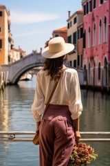 A woman is walking on the sidewalk in Venice