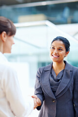 Obraz premium Business women, handshake and introduction to job interview, Human Resources meeting or welcome for hiring. Professional people or clients shaking hands for recruitment, career success or opportunity