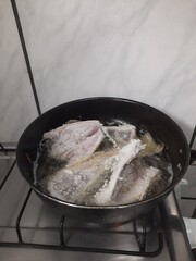frying fish with meat