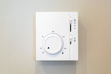 Air conditioner control panel for room climate system mounted on the wall.