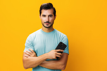 Smiling man portrait smartphone space mobile yellow copy phone communication studio happy phone cyberspace