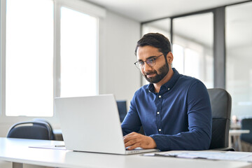 Busy serious professional Indian business man company employee, male worker, manager or financial...