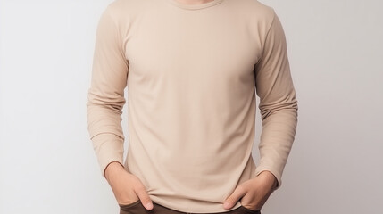 Man wearing beige long sleeve t-shirt, isolated in white background