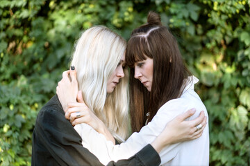 Fototapeta premium Fashion girls twins posing in nature