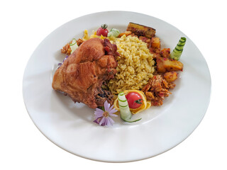 Indonesian fried rice with fried chicken on a white plate isolated