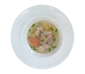 chicken soup with vegetables, flat lay on white plate, isolated on white background