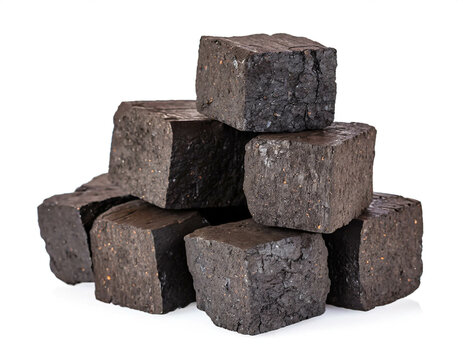 Brown coal briquettes isolated on white background, cut out
