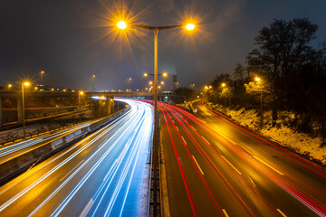 Fototapeta na wymiar City motorway in rush hour in the evening with motion light trails and moving traffic