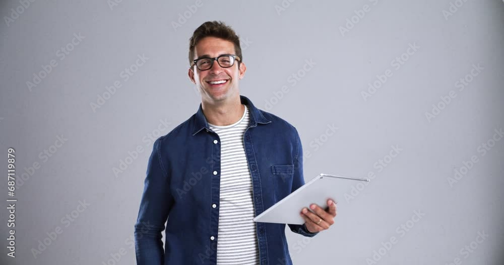 Sticker Business, man and tablet in studio with happy, face and confidence for marketing career at work. Entrepreneur, person and portrait with smile for typing or scroll on touchscreen and gray background