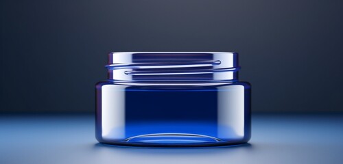 Elegant, clear glass skincare jar with space for labels, set on a vibrant, indigo blue background, showcasing a luxurious feel. Copy space on label.