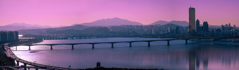 Seoul City panoramic skyline at sunset with skyscrapers, Han River, Mapo Bridge, water reflections...