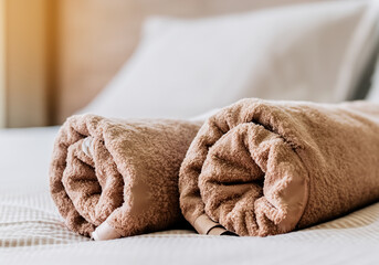 towels beige brown color on the bed